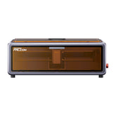 A front view of the compact Creality Falcon Falcon A1 10W Enclosed Diode Laser Engraver shows a modern desktop unit with a transparent amber cover, designed to fit any space and ideal for precise laser engraving or cutting tasks.