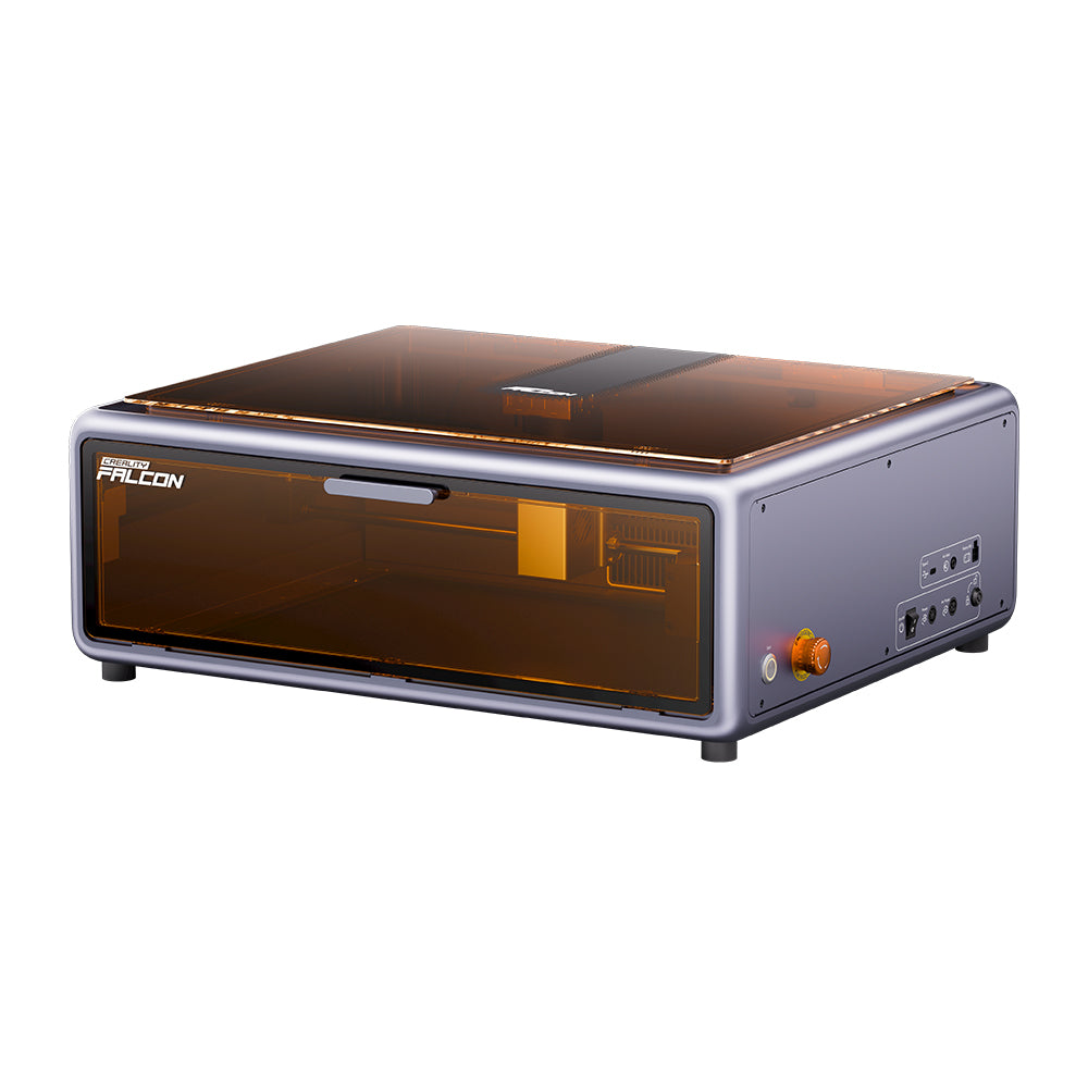 The Creality Falcon Falcon A1 10W Enclosed Diode Laser Engraver is a compact, rectangular machine with a transparent amber lid, control buttons and ports on the side panel—designed to fit any space. The Creality Falcon Falcon A1 10W Enclosed Diode Laser Engraver is a compact, rectangular machine with a transparent amber lid, control buttons and ports on the side panel—designed to fit any space.