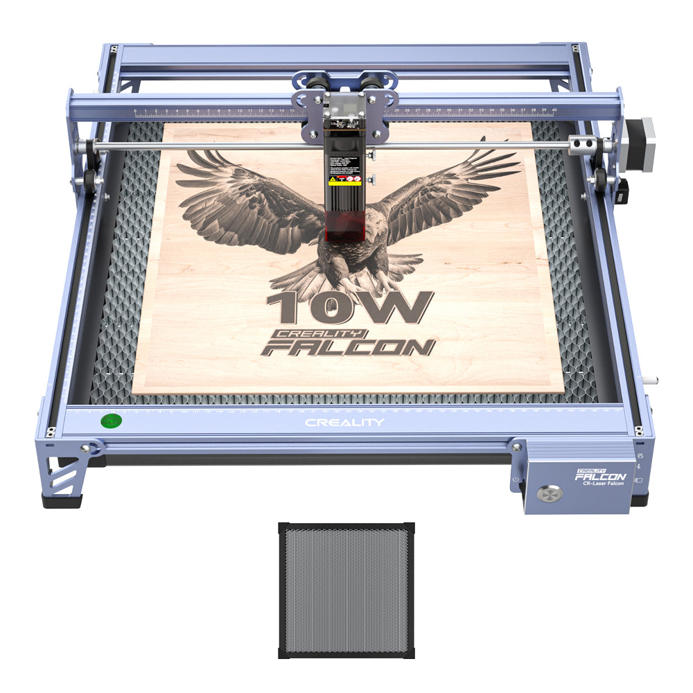 The Creality Falcon 10W CR-Laser Falcon Laser Engraver and Cutter precisely etches a soaring eagle and "10W CR-Laser Falcon" onto wood. The metallic, rectangular device has a control unit above the engraving area for easy use.