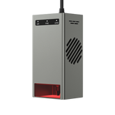 The Creality Falcon Laser Module 40W for Falcon2 Laser Engravers features a metallic rectangular build, vented side, "AIR," "FIRE," and "LENS" buttons, red transparent bottom front, and is suspended by a black cable for ultra-fast engraving.