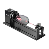 The Creality Falcon Rotary Kit Pro for Curved Surface Engraving, in black, uses adjustable jaws to hold a goblet-shaped object horizontally between two fixtures on a metal base.
