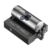 The Creality Falcon Rotary Roller for Laser Engraving Machine, featuring adjustable width, is engraving a blue and black butterfly design onto a cylindrical metal tumbler, suitable for tumblers or bottles of various diameters.