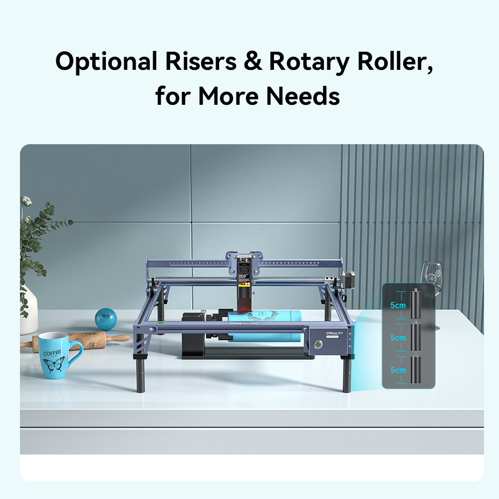 The Creality Falcon CR 10W Diode Laser Engraver sits on a white table with a blue mug, blue ball, and plant nearby. Its display reads “Optional Risers & Rotary Roller, for More Needs,” highlighting its large engraving area and adjustable height. The Creality Falcon CR 10W Diode Laser Engraver sits on a white table with a blue mug, blue ball, and plant nearby. Its display reads “Optional Risers & Rotary Roller, for More Needs,” highlighting its large engraving area and adjustable height.