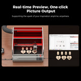 The Creality Falcon Falcon2 Pro 60W Enclosed Diode Laser Engraver etches heart-shaped wood, shown beside a PC with matching designs. With FDA Class 1 safety, it offers real-time preview and one-click picture output for easy creation.