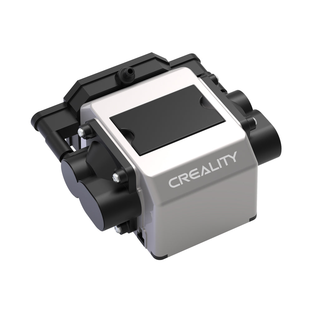 A Creality Falcon Air Assist for the CR-Laser Falcon 7.5W and 10W Engraver in a metallic finish features a compact design with black cylindrical components on the sides and a flat top surface. The brand name "CREALITY FALCON" is printed on the casing. Its low working noise ensures a quieter engraving environment.