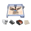 The Creality Falcon CR 10W Diode Laser Engraver is etching an eagle and “10W Falcon” on wood. Below it are metal sheets, an air assist device, a safety enclosure, and wooden boards as included accessories.