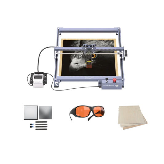 The Creality Falcon 10W Falcon Laser Engraver and Cutter Bundle Basic Kits etches a black-and-white eagle onto wood, with orange safety glasses, markers, blank panels, and Basswood Sheets displayed on a crisp white background.
