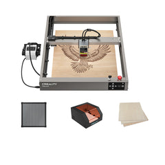 The Creality Falcon2 12W Laser Engraver and Cutter by Creality Falcon engraves an eagle on a wood sheet with its ultra-fast laser and built-in air assist, shown with a honeycomb panel, orange protective enclosure, and extra wooden sheets.
