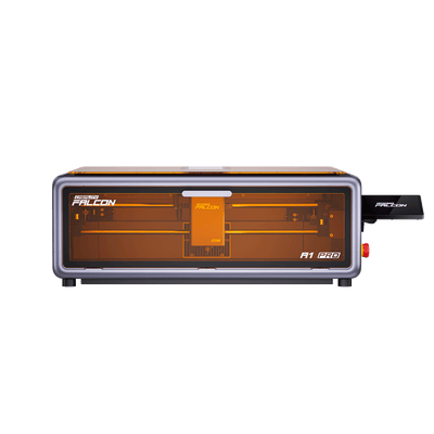 Front view of the Creality Falcon A1 Pro 20W Dual-laser Engraver, a rectangular machine with a transparent orange cover, visible internal parts, and a USB stick inserted on the right side.