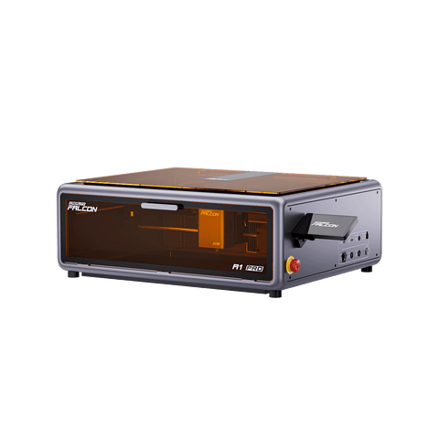 The Creality Falcon A1 Pro 20W Dual-laser Engraver is a compact desktop device with a transparent orange lid, precision controls and side ports, designed for detailed engraving projects.