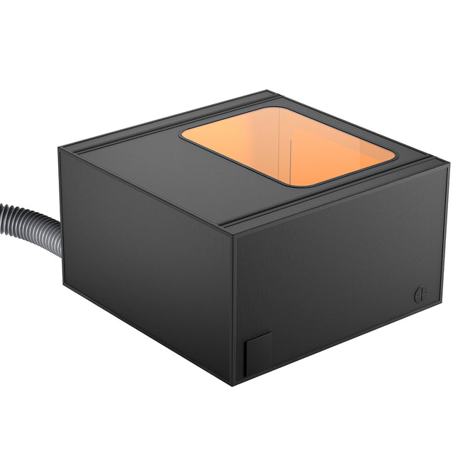 Introducing the Protection Enclosure Pro for Falcon Laser Engravers by CrealityFalcon: a sleek, black, rectangular electronic device featuring a transparent top window that reveals an orange interior. A coiled cable extends from the left side, indicating connectivity or power supply to another device. Boasting a minimalistic and modern design, this enclosure is both dustproof and waterproof for enhanced durability.