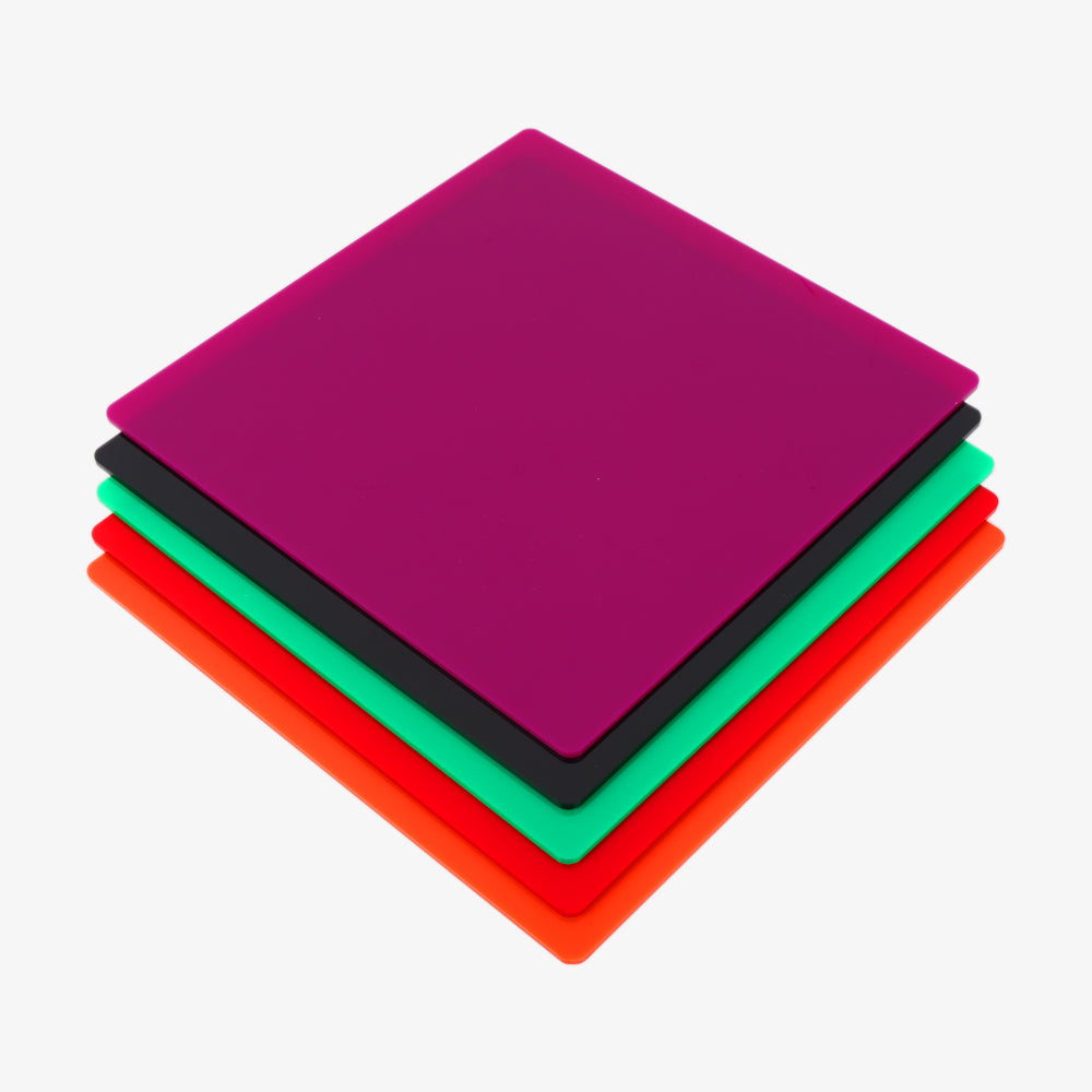 A stack of Creality Falcon's vibrant, opaque, glossy acrylic sheets in purple, black, green, orange, and red from their 36-piece mega pack sits on a crisp white background.