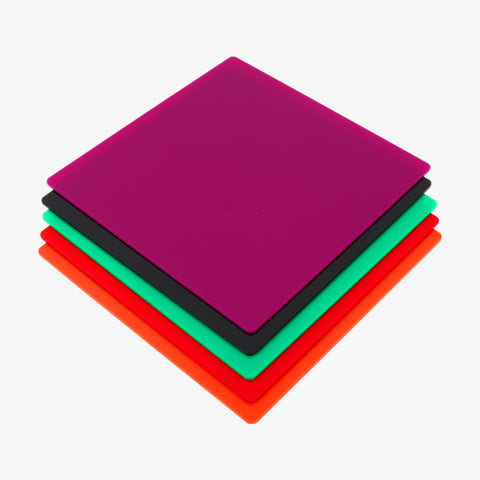 A stack of Creality Falcon's vibrant, opaque, glossy acrylic sheets in purple, black, green, orange, and red from their 36-piece mega pack sits on a crisp white background.