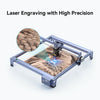 The Creality Falcon CR 5W Diode Laser Engraver etches a detailed image of bird feathers, showcasing ultra-fine engraving precision. Text above reads: "Laser Engraving with High Precision.