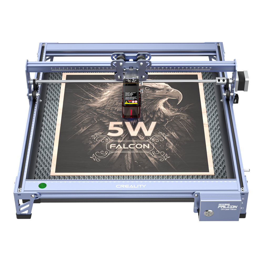 The Creality Falcon 5W CR-Laser Falcon Engraver and Cutter, featuring advanced design and ultra-fine precision, engraves an eagle and "5W FALCON" onto a square wooden board within its blue metal frame marked "CREALITY.