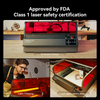 This image showcases the Creality Falcon Falcon2 Pro 60W, an enclosed laser cutter and engraver with red protective glass. It is FDA-approved with Class 1 laser safety certification, featuring adjustable cutting power, a lid-open stop for safety, laser engraving capabilities, and a built-in camera for precision.
