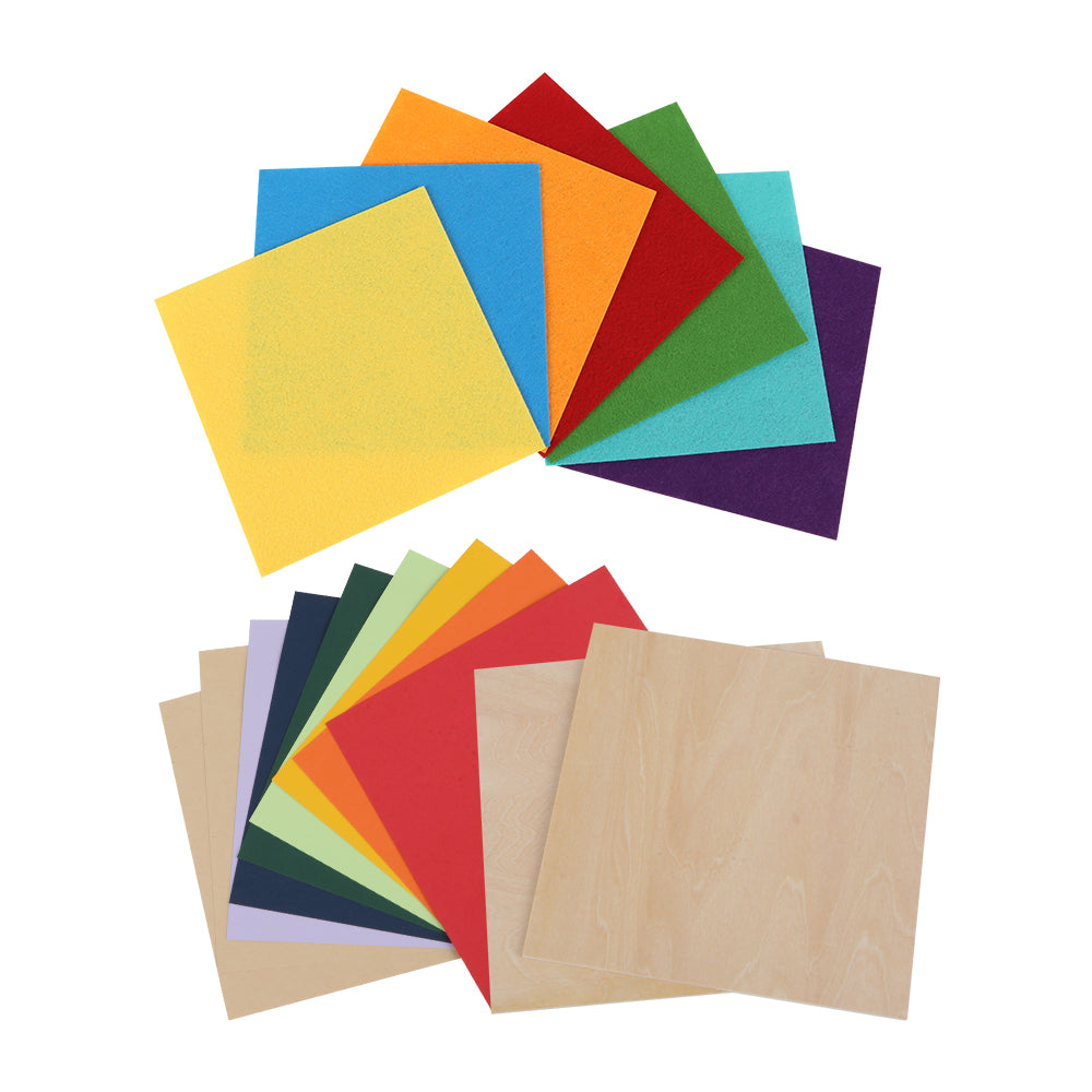 The Creality Falcon Laser Material Package features square cards of colored felt paper (blue, red, yellow, green, orange, purple) and plain basswood-textured cards, arranged in overlapping fans on a white background. Intelligent recognition included.