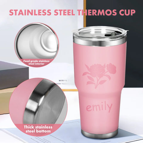 A Creality Falcon "Car Water Cup DIY Women's Gift Set for Laser Engraving," designed with a pink stainless steel finish that showcases floral engravings and the name "Emily," is ideal for birthday gifts for women. The cup is placed on a table, highlighting its clear lid and close-up view of its food-grade construction and thick stainless steel bottom, ensuring both style and durability.