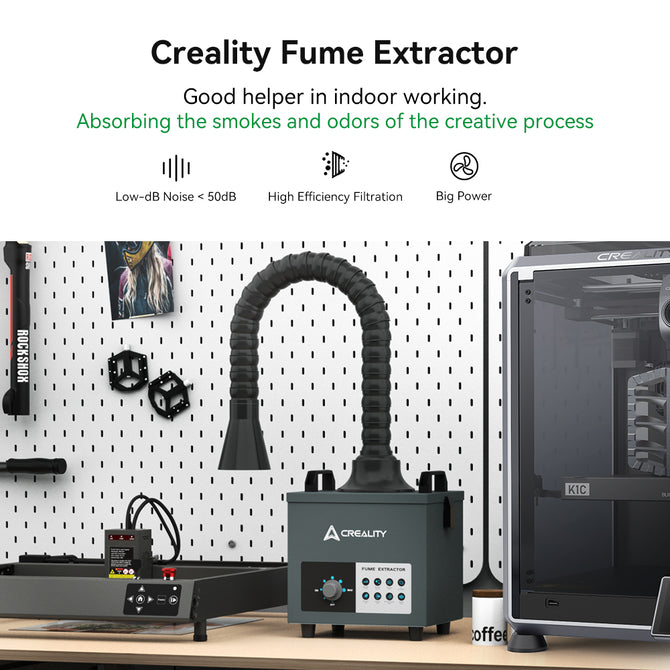The Creality Falcon Air Purifier for 10W Engraving Machines sits on a workspace with a pegboard backdrop, featuring an adjustable hose and control panel to absorb smoke and odors. Nearby are tools and 3D printer accessories. It boasts low noise operation, HEPA filters for high filtration, and robust power.