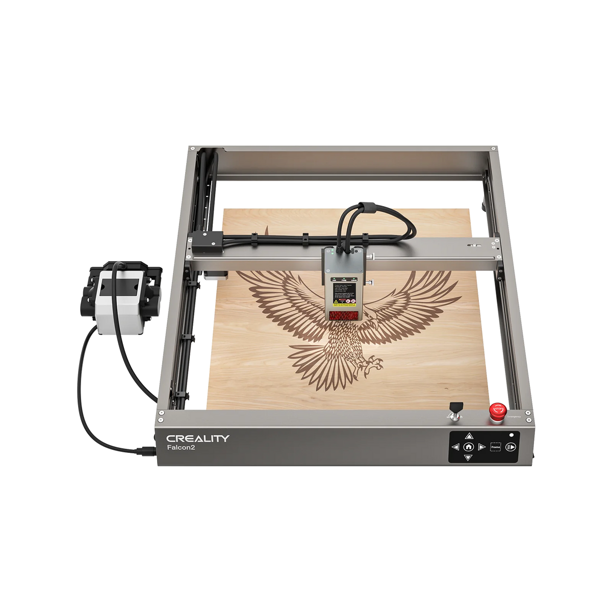 The Creality Falcon Falcon2 12W Laser Engraver and Cutter etches a detailed eagle with outstretched wings onto wood, with its metallic frame and front control buttons visible.