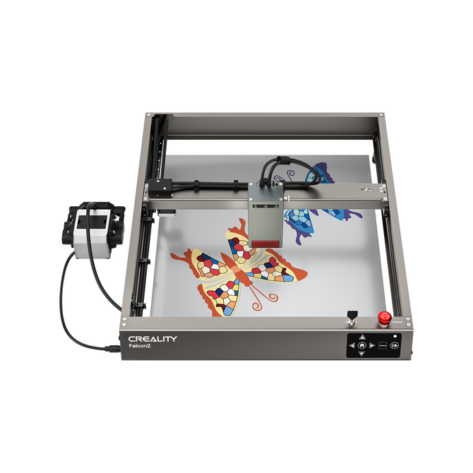 A Creality Falcon Falcon2 40W Diode Laser Engraver with an anodized aluminum alloy frame engraves colorful butterfly designs on a flat surface, its head positioned above the artwork.