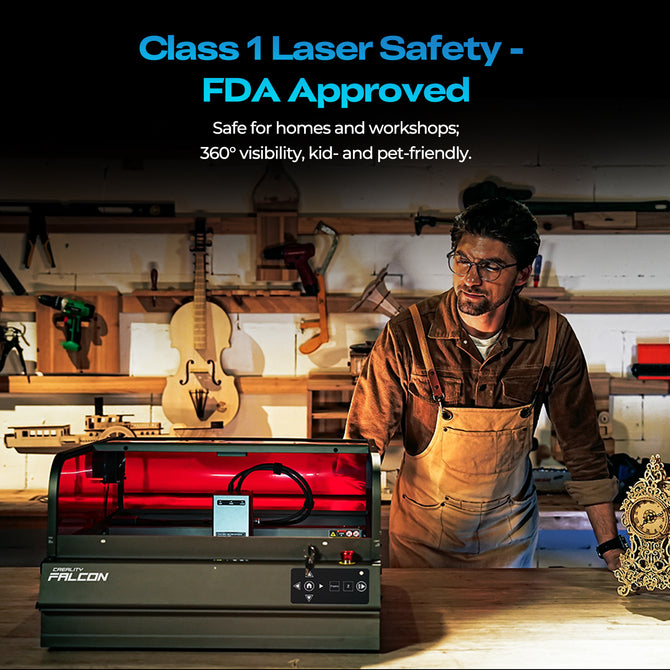 A man in overalls stands beside a Creality Falcon Falcon2 Pro S 40W Enclosed Diode Laser Engraver in an organized workshop, tools on the wall. Text above notes its FDA-approved Class 1 laser safety.