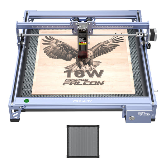 The Creality Falcon 10W CR-Laser Falcon Engraver Upgrade Package + Free Test Kit etches an eagle image and text onto wood. It features a sturdy metal frame, "FALCON" control panel, and includes a small filter underneath.