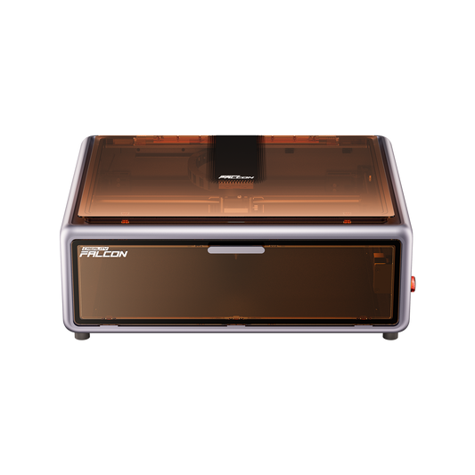 The Creality Falcon A1 Enclosed Laser Engraver and Cutter is a compact, rectangular CoreXY desktop machine with a transparent orange lid and “FALCON” branding, designed to fit any space easily. 1600