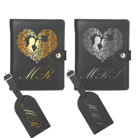 Two black Creality Falcon custom leather passport holders with heart designs are shown together. The left has a gold motif; the right, silver. Both feature engraved initials "M R," include matching luggage tags, and each displays silhouettes within the hearts.