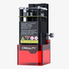 Close-up of the Falcon Laser Module 1.6W by Creality, featuring a red base with safety warnings and product details. It's ideal for 3D printing or engraving, compatible with several machines, and includes specifications and precautions for Falcon Safe use.