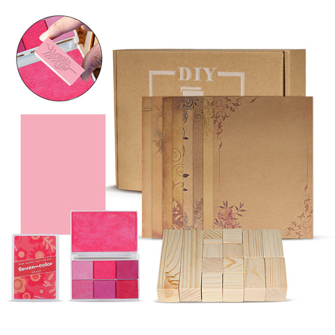The Creality Falcon Wooden Rubber Stamp Set includes 14 pieces and a 6-color ink pad, ideal for crafting with cardboard boxes, decorative papers, and wooden blocks. Perfect for creating custom rubber sheets or experimenting with laser engraving techniques. Image: hand stamping on pink paper.