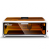 The Creality Falcon Falcon A1 Enclosed Laser Engraver and Cutter features a white frame, amber lid, visible mechanical parts, "FALCON" front label, CoreXY 600mm/s motion, and auto material recognition for precise, efficient engraving and cutting.