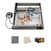 A Creality Falcon2 40W Diode Laser Engraver with a vibrant butterfly design being engraved. Shown with three accessories: a filter, wooden sheets, and a Creality-branded box. Built with an anodized aluminum alloy for stability.