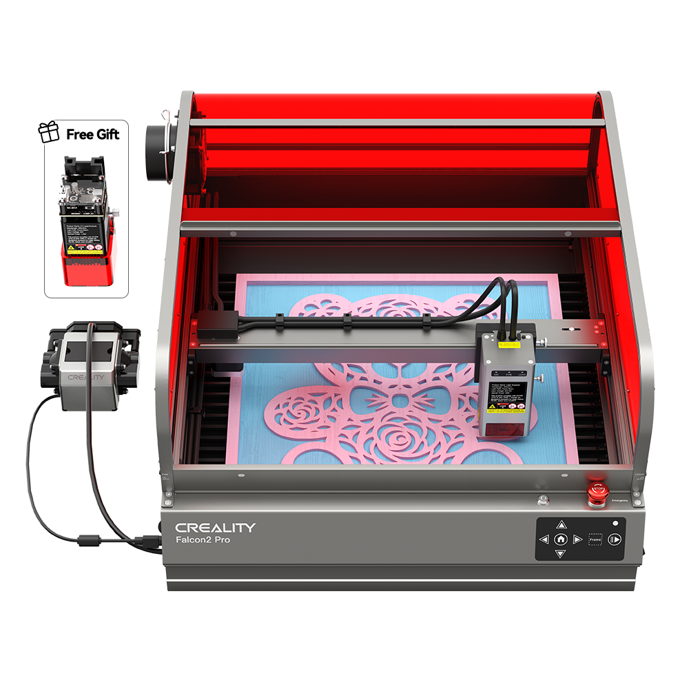 A Creality Falcon Falcon2 Pro 60W Enclosed Laser Cutter and Engraver is seen adjusting its cutting power. The laser arm engraves a detailed pattern on a blue surface under the red safety cover, with its control panel and wiring visible on the left of this advanced machine.