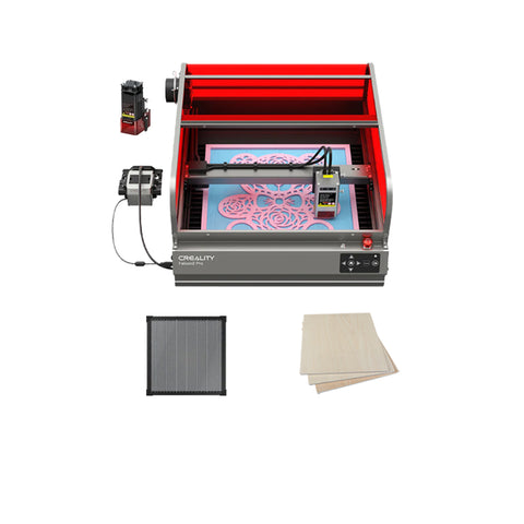The Creality Falcon Falcon2 Pro 60W Enclosed Laser Cutter and Engraver, with a red frame and digital display, features auto-positioning. It includes parts and accessories like a lens, grid mat, and wooden sheets neatly arranged on a flat surface.