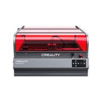The Creality Falcon Falcon2 Pro 60W/40W/22W Enclosed Diode Laser Engraver + Free Test Kit features a gray base, right-side control buttons, transparent red safety lid, FDA Class 1 safety design, and sits on a plain white background.